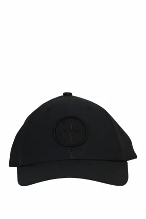 Gorra negra con maxilogo brújula monocromático